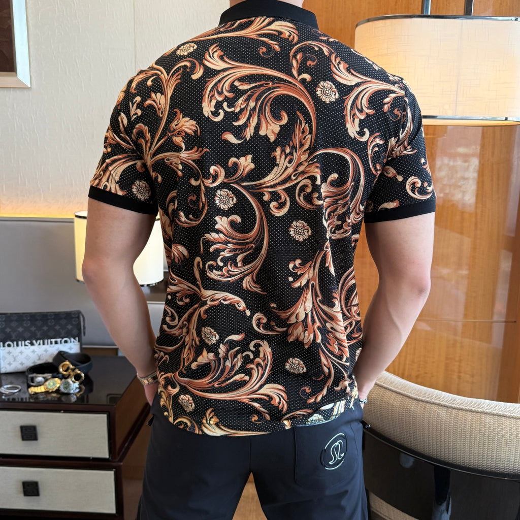 Back view of short-sleeve polo shirt with black base and gold-orange ornate print