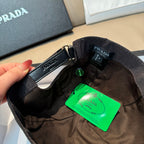 PRADA cap interior with metal buckle, adjustable strap, and green product tag