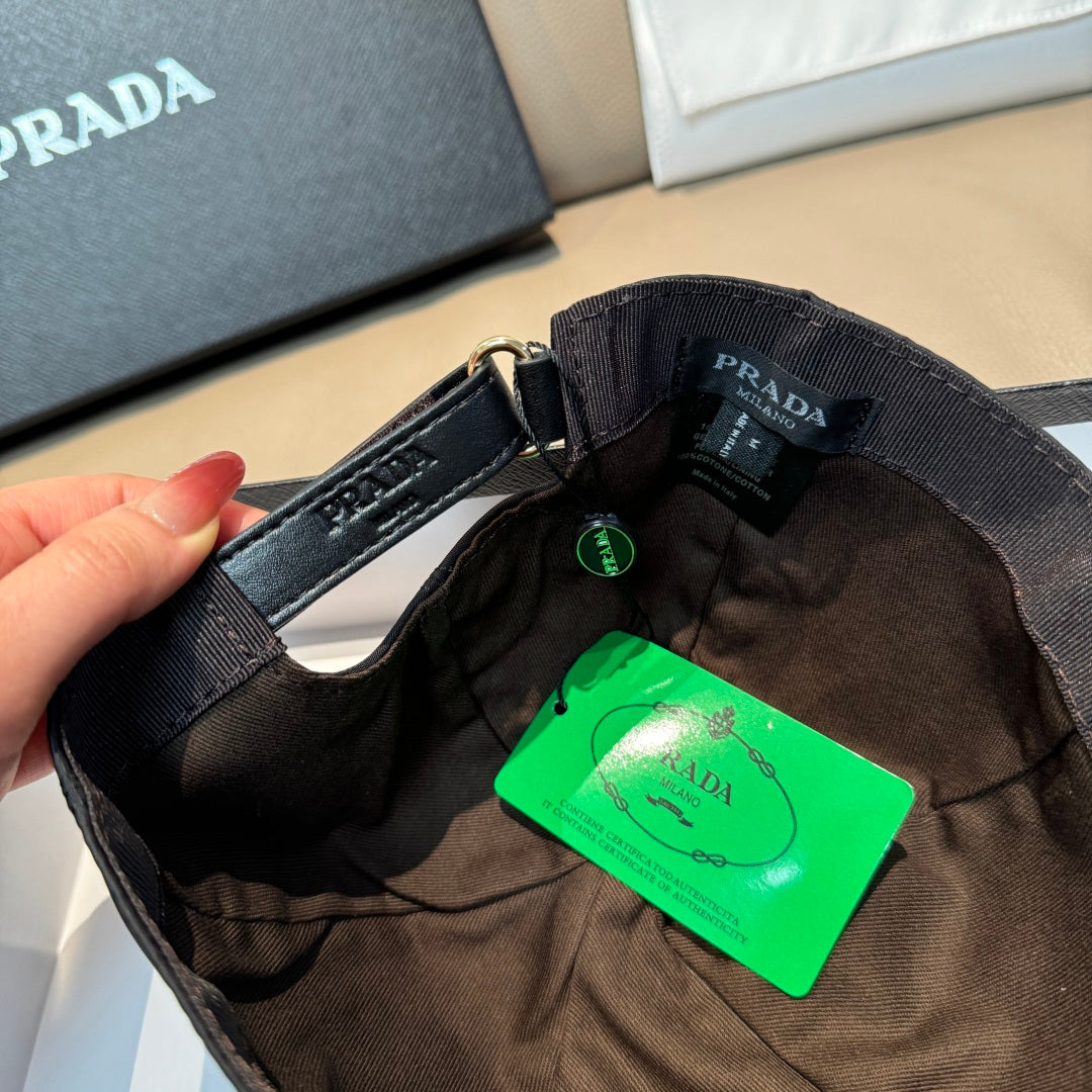 PRADA cap interior with metal buckle, adjustable strap, and green product tag