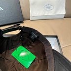 PRADA cap interior with adjustable strap and woven label, green tag attached