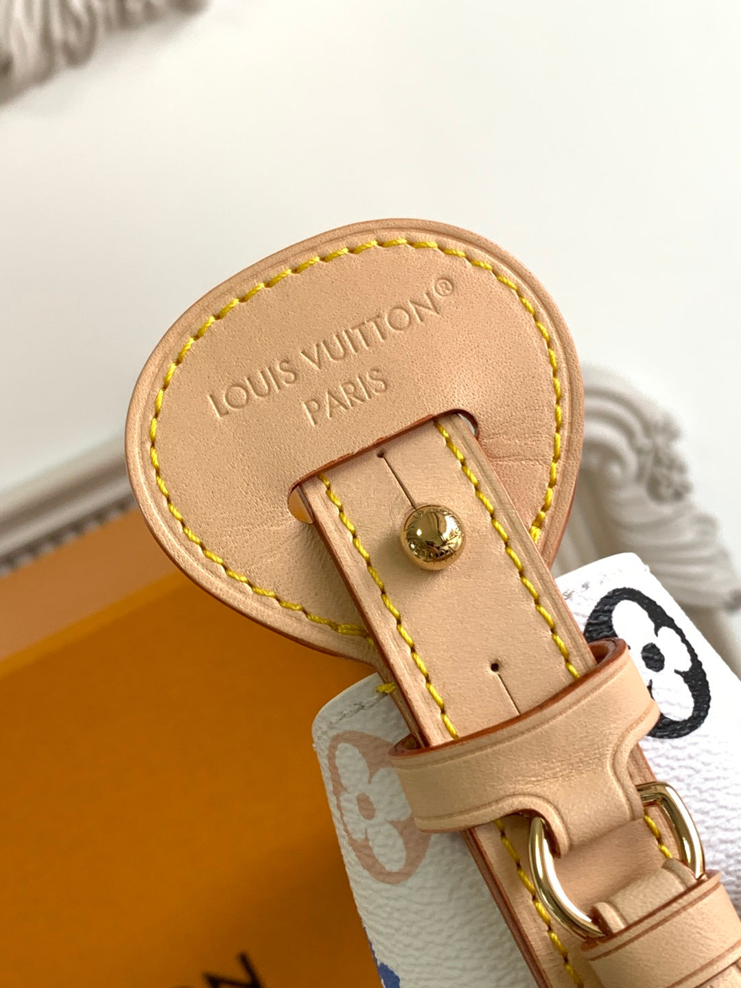 Louis Vuitton multicolor monogram mini bag close-up of tan handle tab and ring