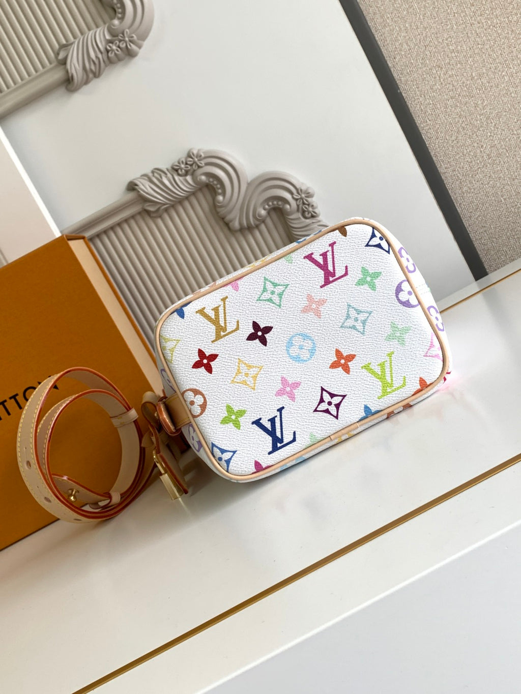 Louis Vuitton multicolor monogram mini handbag with tan trim and curved top