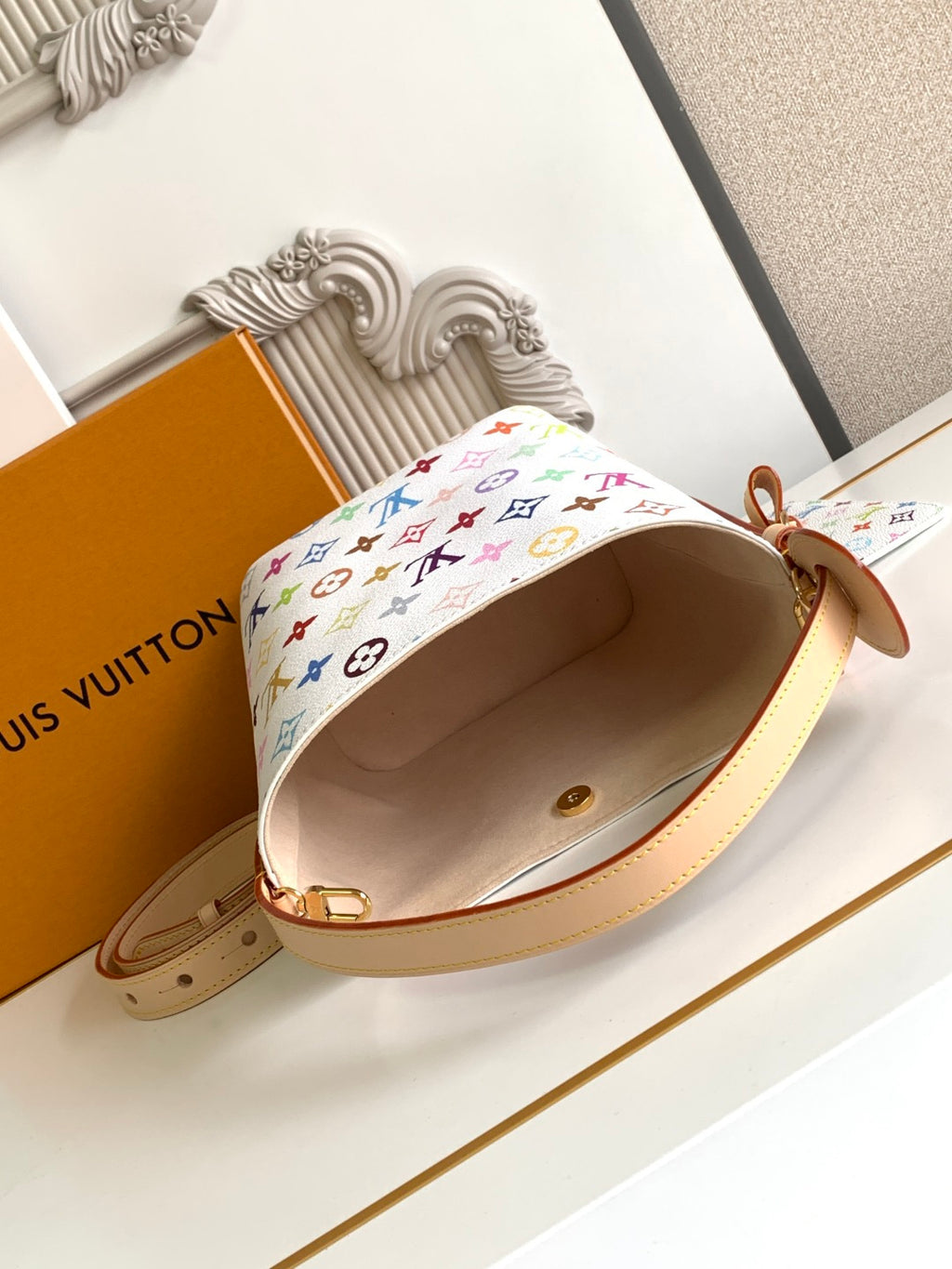 Louis Vuitton multicolor monogram mini bag with tan strap and open beige interior
