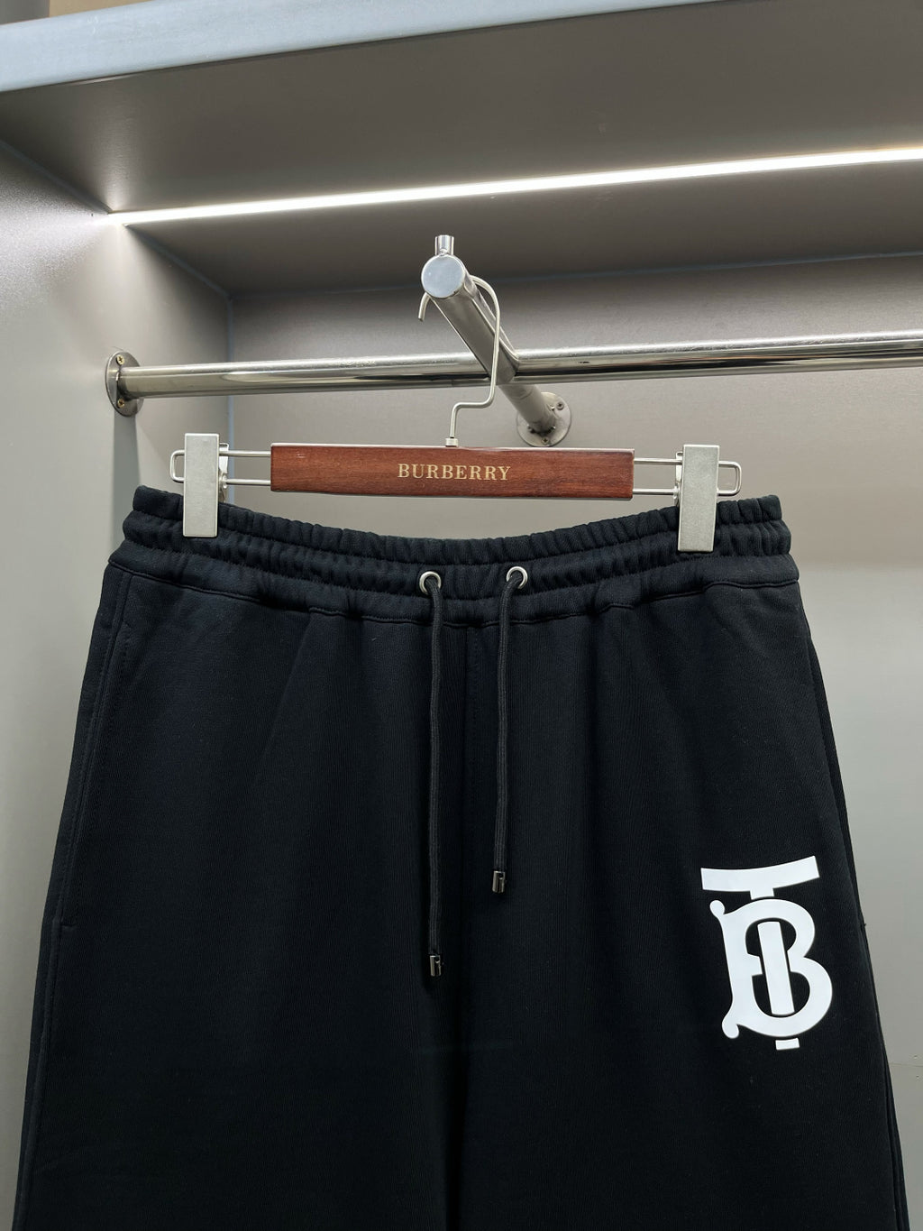 Burberry dark navy drawstring track shorts with white TB logo on side