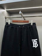Burberry dark navy drawstring track shorts with white TB logo on side