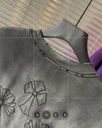 Gray short-sleeve T-shirt collar and chest area with black stitched flower embroidery.