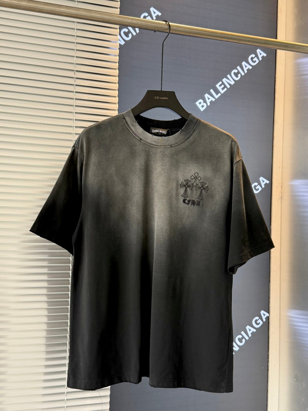 Dark charcoal short-sleeve T-shirt with small chest graphic logo
