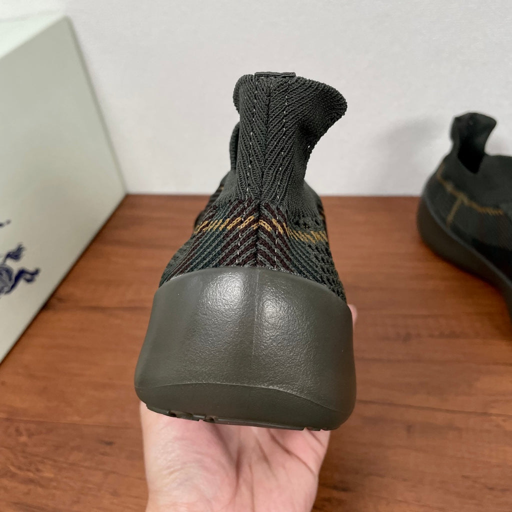 Burberry sneakers rear view, dark knit sock collar and rubber heel