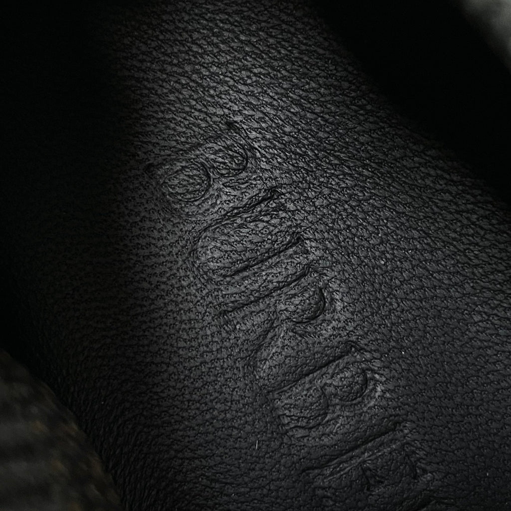 Burberry sneaker upper detail, dark textured fabric with embossed stitching