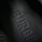 Burberry sneaker upper detail, dark textured fabric with embossed stitching