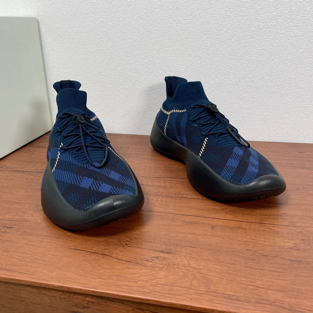 Burberry blue knit sock sneakers with blue laces and yellow trim stitching