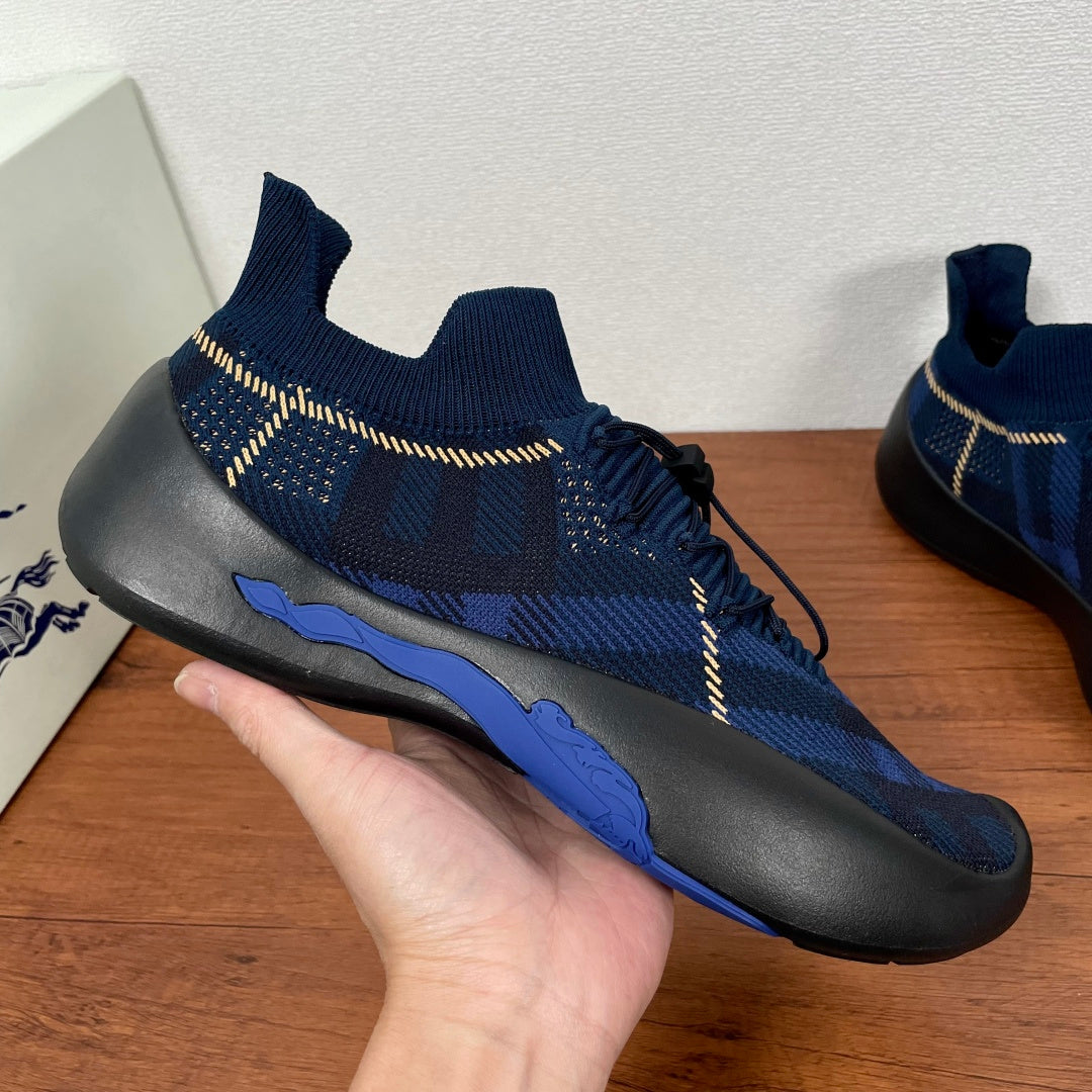 Burberry blue knit sneaker with yellow stitching and blue sole accent