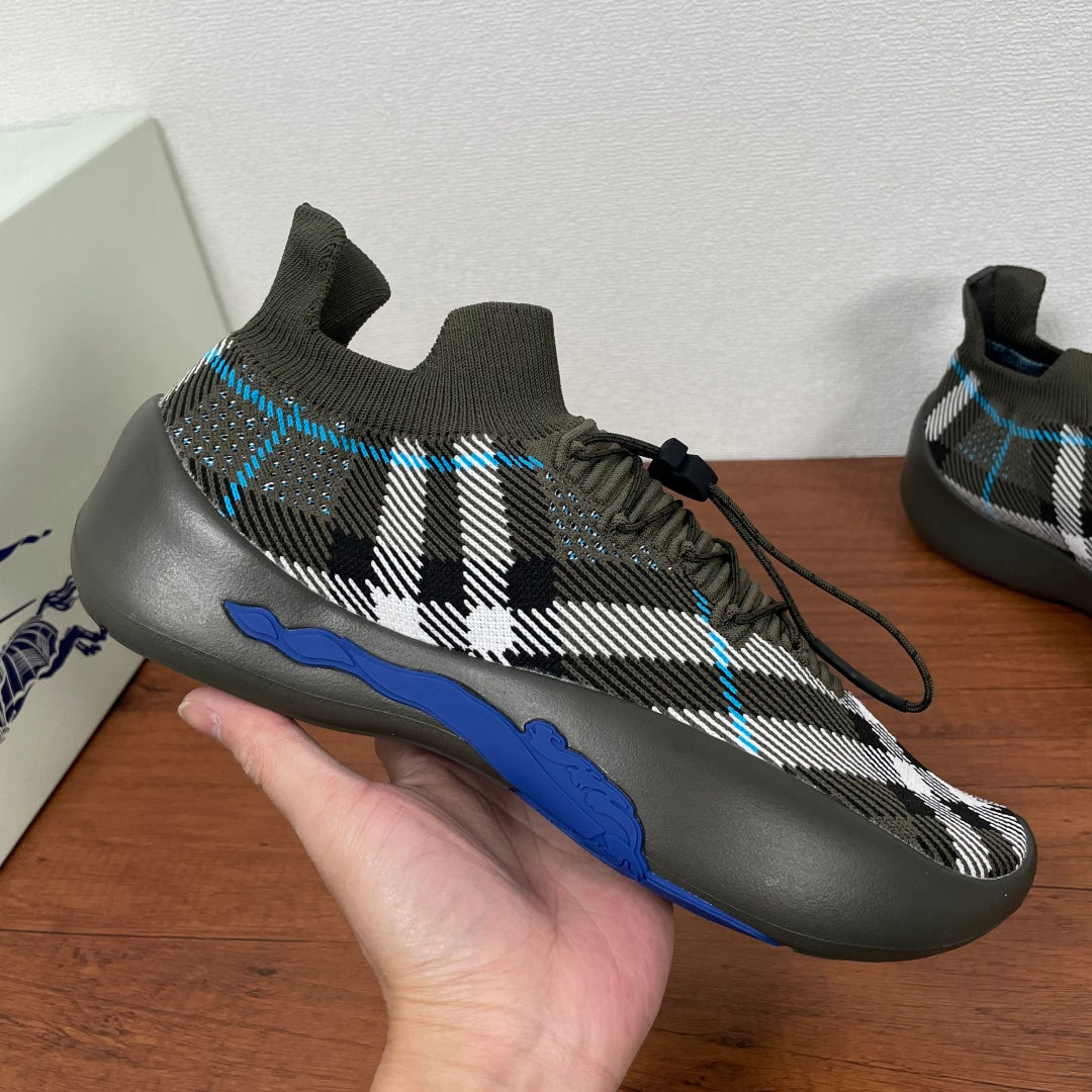 Burberry knit sneaker on hand, black-and-white plaid with blue side stripe