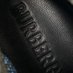 Burberry knit sneaker upper detail, dark textured fabric with lace eyelets
