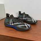 Burberry knit sneakers with black-and-white plaid print and blue stripe detail