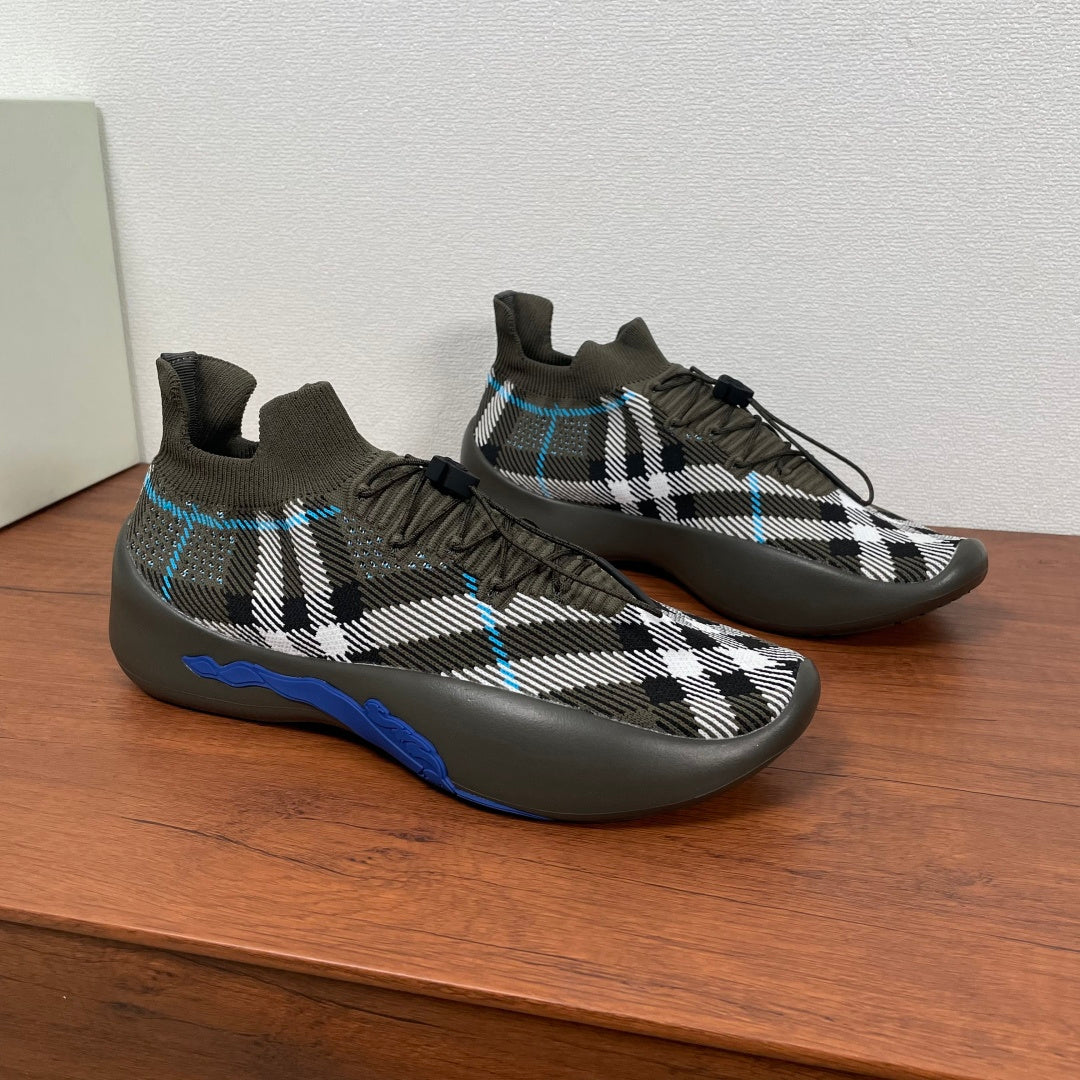 Burberry knit sneakers with black-and-white plaid print and blue stripe detail