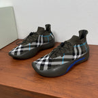 Burberry knit sneakers in dark olive with black-and-white plaid and blue accents