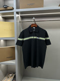 Burberry polo shirt in dark navy with green-and-white striped placket and horse logo