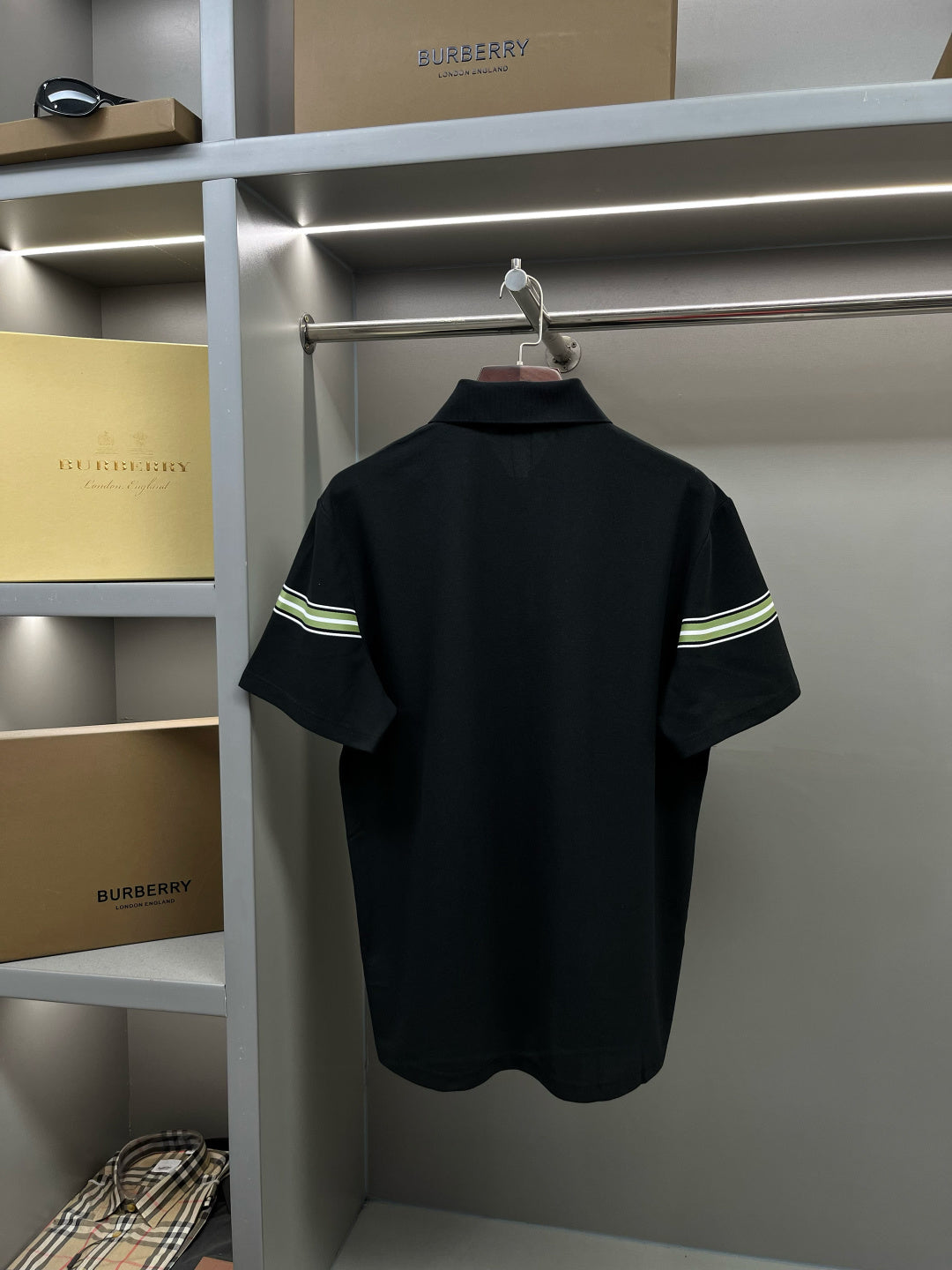 Burberry polo shirt back view in dark navy with striped band on sleeves