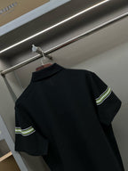 Burberry polo shirt back with dark navy fabric and green-striped sleeve bands