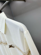 Burberry polo shirt sleeve with horse logo and tan stripe band detail