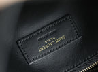 Black leather YSL bag tag with “SAINT LAURENT” text and stitching