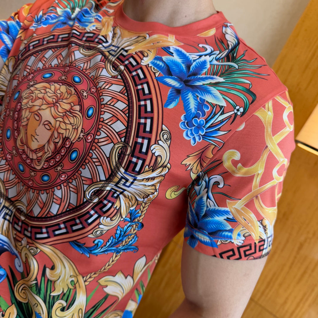 Graphic print T-shirt side view with blue floral pattern and ornate border