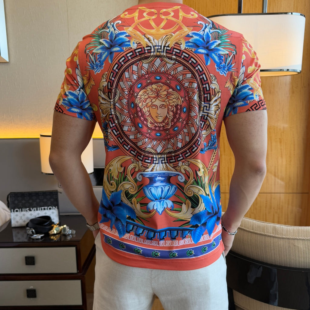 Graphic print T-shirt back view with Medusa emblem and blue floral accents