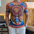 Graphic print T-shirt with ornate Medusa face, blue florals, red-orange base
