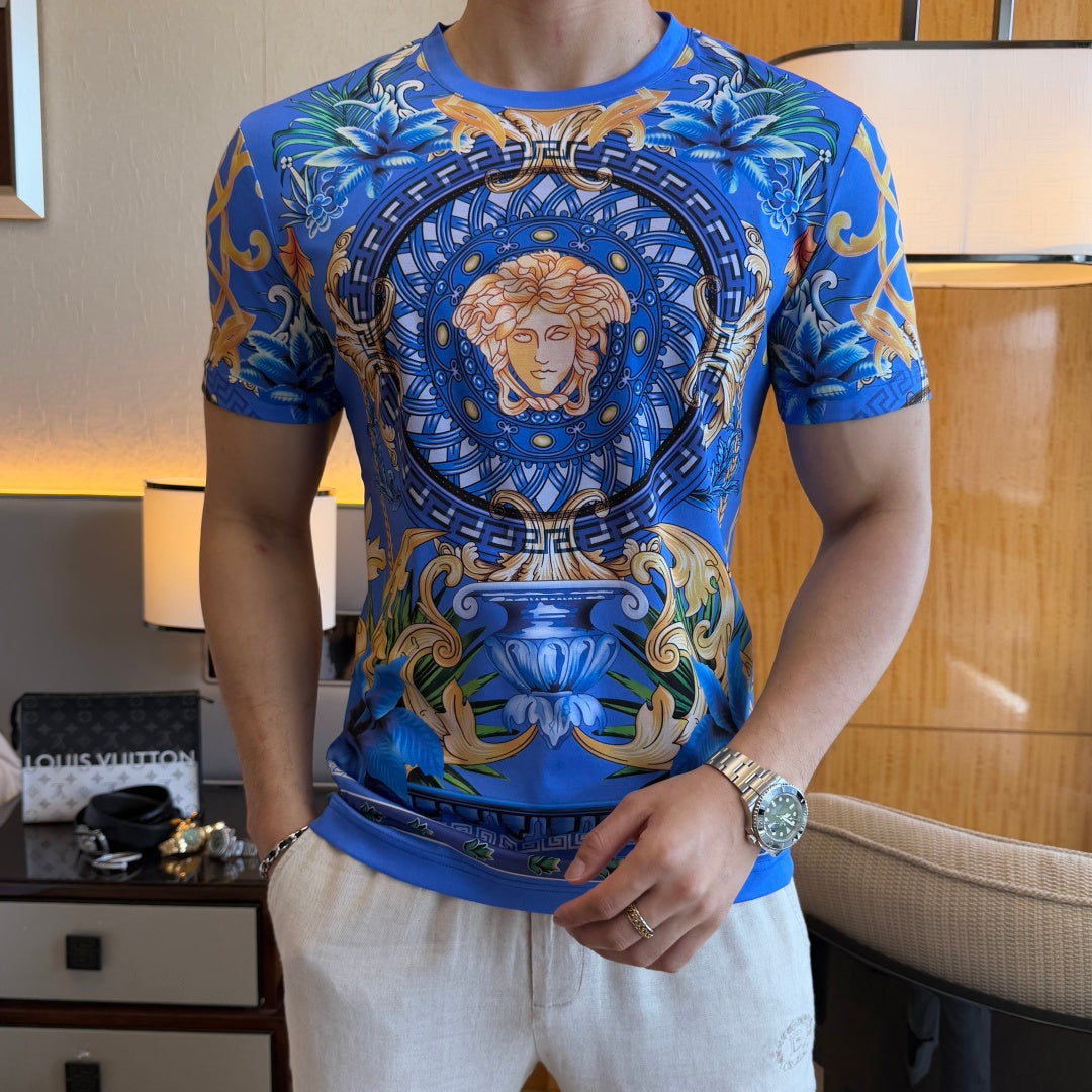 Blue graphic T-shirt with large circular Medusa portrait and gold, green, and white details