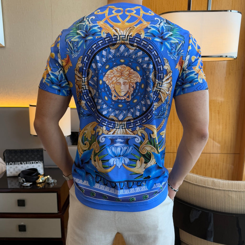 Blue graphic T-shirt back with large circular Medusa portrait emblem and scroll border