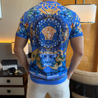 Blue graphic T-shirt back with large circular Medusa portrait emblem and scroll border