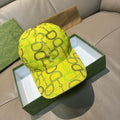 Yellow GG-print baseball cap with Gucci logo on front.