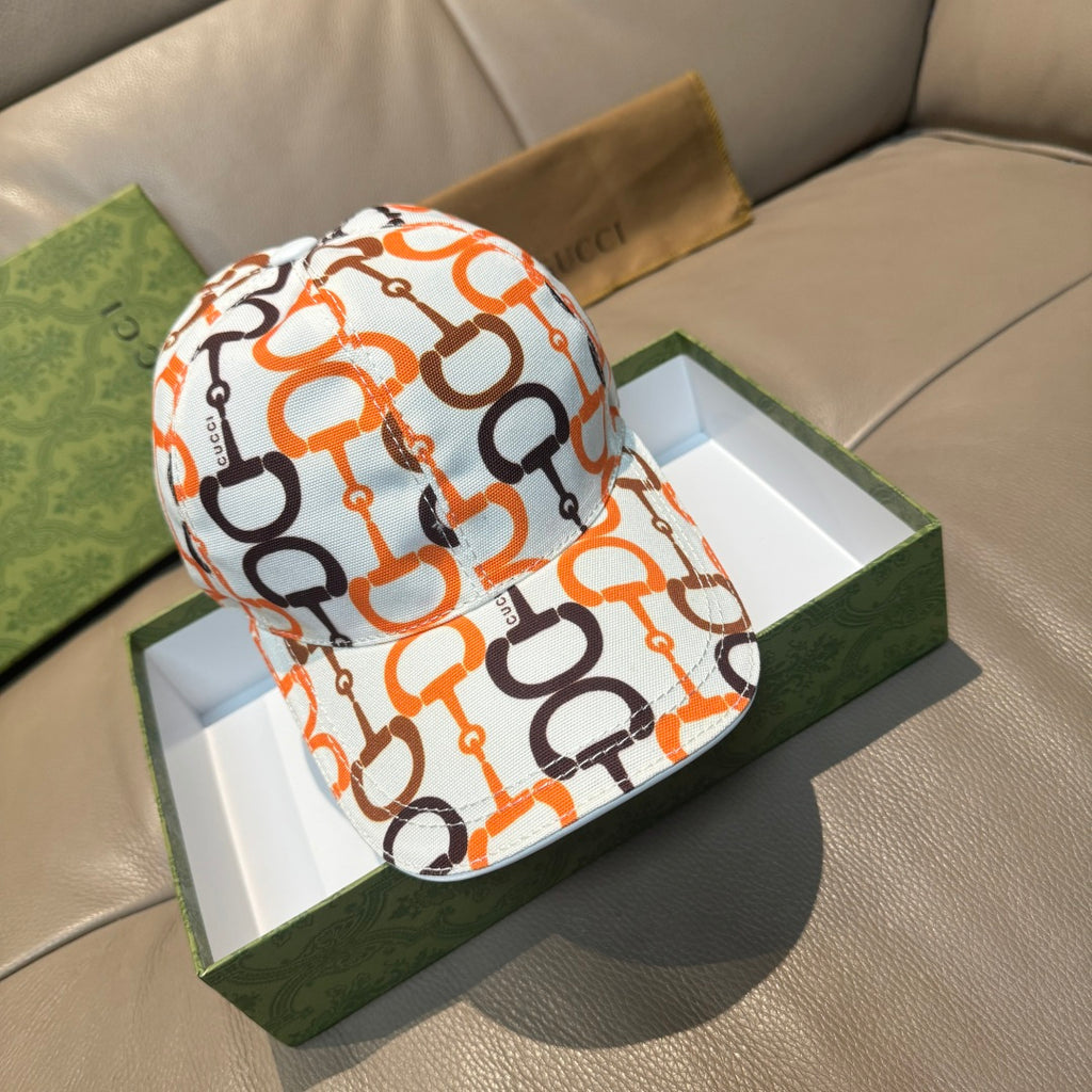 Gucci cap with white base and orange and black link logo print, curved brim.