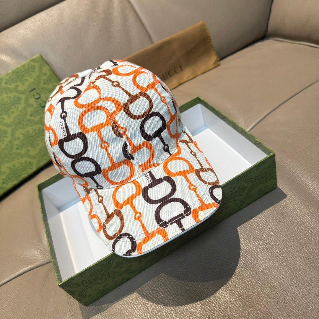Gucci cap with white base and orange and black link logo print, curved brim.
