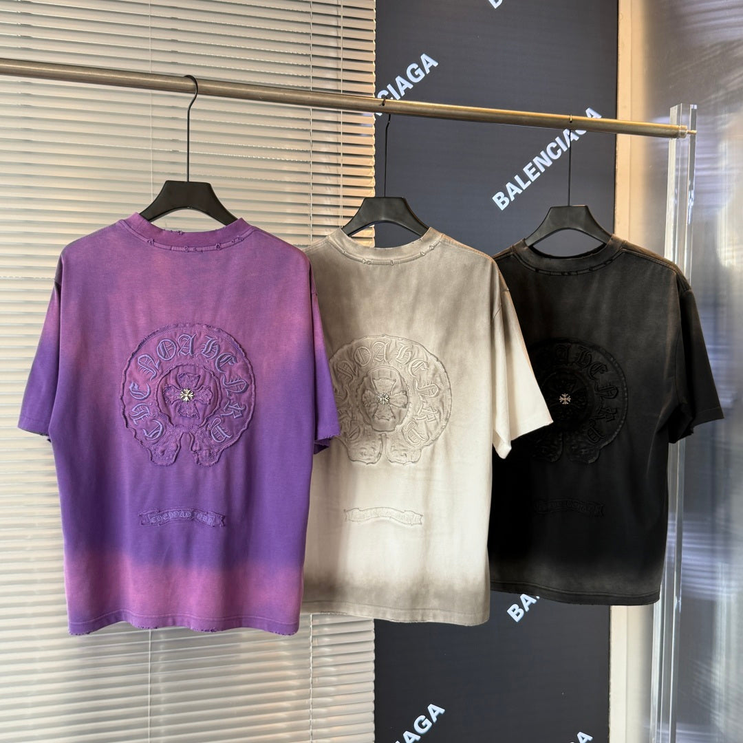 Crewneck short-sleeve T-shirt trio on hangers: purple, cream, and black colors