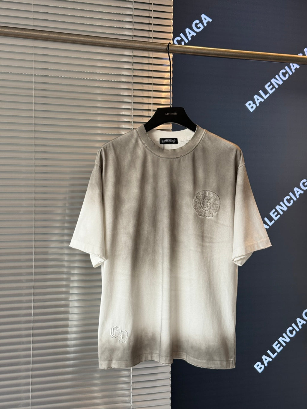 Cream crewneck short-sleeve T-shirt with small front crest graphic detail