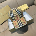 Plaid baseball cap with curved brim, beige, black, white, and red check pattern.