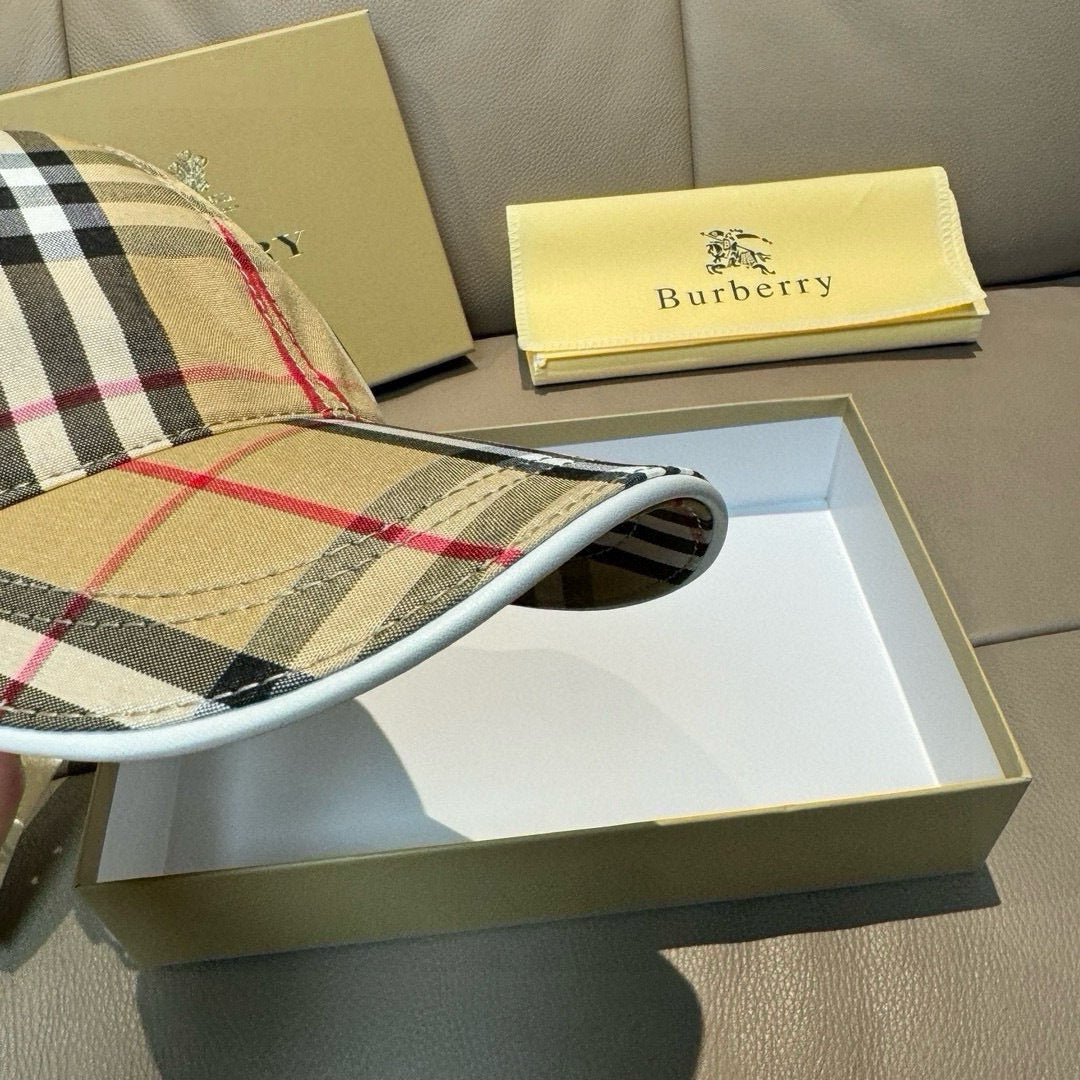 Plaid baseball cap showing underside of curved brim and stitched brim edge.
