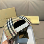 Plaid baseball cap with adjustable strap and white label patch inside the band.