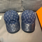 Pair of baseball caps with dark blue monogram panels and curved brims