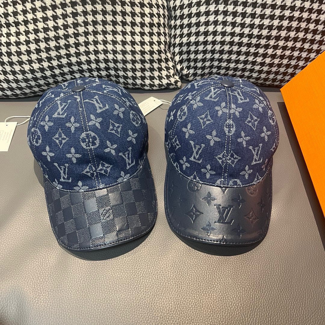 Pair of baseball caps with dark blue monogram panels and curved brims
