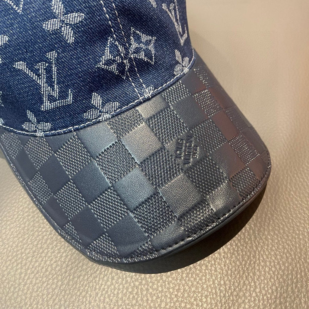 Louis Vuitton cap close-up: blue denim checkered brim with stitched logo accents