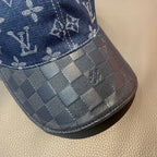 Louis Vuitton cap close-up: blue denim checkered brim with stitched logo accents