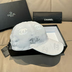 Chanel cap light white with CC logo print, curved brim, and hanging tag