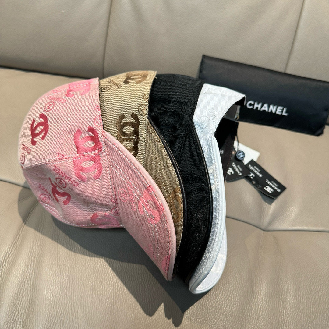 Assorted caps with curved brims: pink, black, and tan with CC details