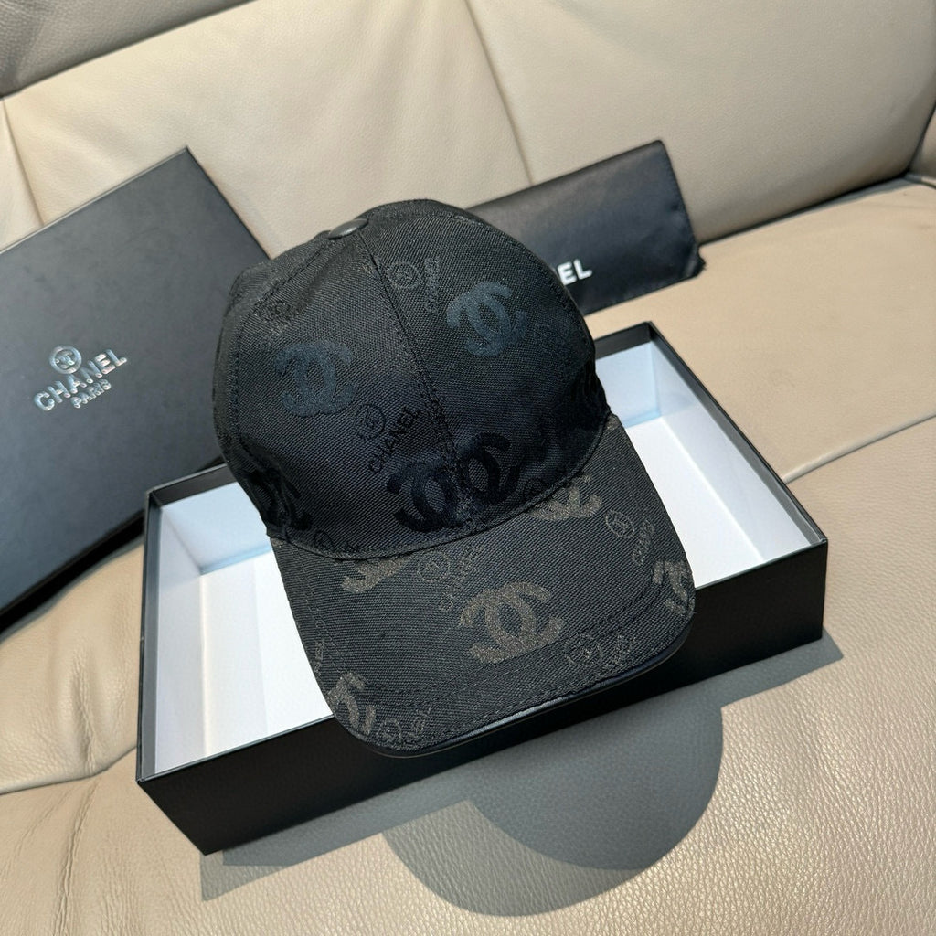 Black monogram baseball cap with curved brim and stitched crown