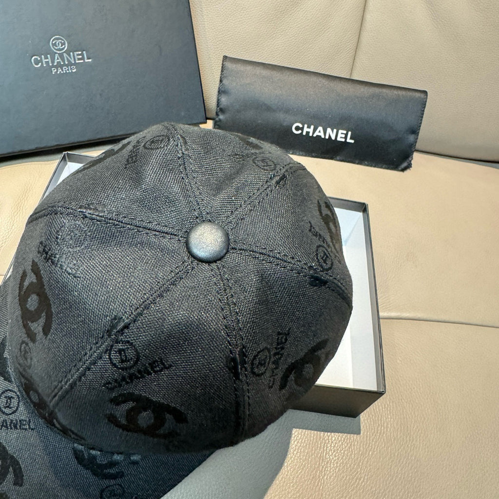 Black monogram baseball cap with round top button and curved brim