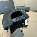 Black monogram baseball cap with adjustable strap and branded label patch