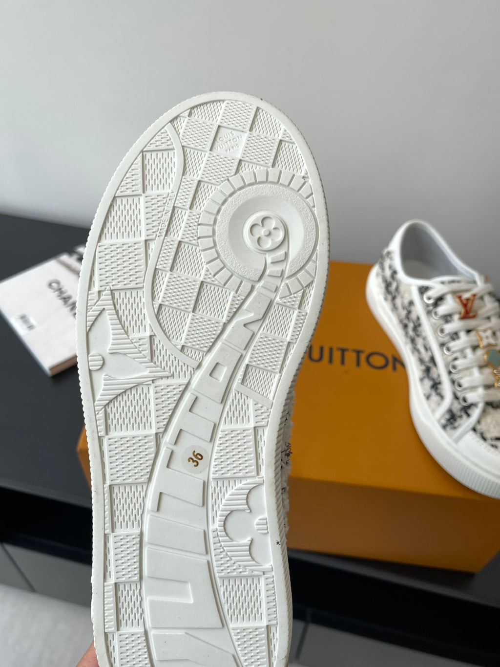 Louis Vuitton women's sneaker outsole with textured tread in white.